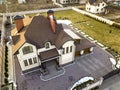 Aerial top view of new residential house cottage with shingle roof on fenced big yard on sunny day Royalty Free Stock Photo