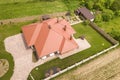 Aerial top view of new residential house cottage with shingle roof on fenced big yard on sunny day Royalty Free Stock Photo