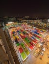 Aerial top view of Night Market people walking street, Colorful tents in the train of Ratchada at Bangkok city, Thailand. Rerail Royalty Free Stock Photo