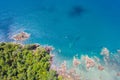 Aerial top view of ocean waves, beach and rocky coastline and beautiful forest. Beautiful nature background. island background and