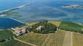 Aerial top view of old church on island from above, canal du Rhone a Sete, Camargue, France Royalty Free Stock Photo