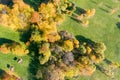 Aerial top view of park trees with orange and yellow leaves during fall season Royalty Free Stock Photo