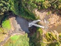 Aerial top view perspective of Chamarel Waterfall in the tropical island jungle of Mauritius.