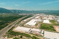 Aerial top view photo of modern industrial zone settled by the highway