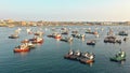 Aerial top view photo of red traditional wooden fishing boat in the harbor