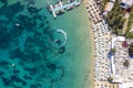 Aerial top view of the popular beach of Psarou, Mykonos island, Greece