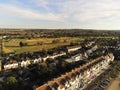 Aerial top view  at pretty terrace Houses in Whitstable, Kent, Uk, England, UK. Evening sunset light on the properties Wave Crest Royalty Free Stock Photo