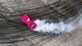 Aerial top view professional driver drifting car on asphalt road track with white smoke, Automobile race car drift on abstract Royalty Free Stock Photo