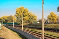 Aerial top view on railway road between trees. Forest landscape background with steel rails. power transmission lines support Royalty Free Stock Photo