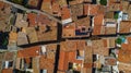 Aerial top view of residential area houses roofs and streets from above, old medieval town, France Royalty Free Stock Photo