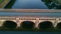 Aerial top view of river, canal du Midi and bridges from above, Beziers town in South France Royalty Free Stock Photo