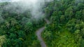 Aerial top view of road in green tree forest, Top view from drone of rural road, mountains, forest. Beautiful landscape with Royalty Free Stock Photo