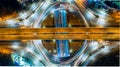 Aerial top view road roundabout intersection in the city at nigh