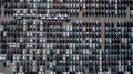 Aerial top view rows of new cars parked in distribution center on car factory, Automobile and automotive car parking lot for Royalty Free Stock Photo