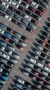 Aerial top view rows of new cars parked in distribution center on car factory, Automobile and automotive car parking lot for Royalty Free Stock Photo