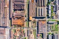 Aerial top view of rusty roofs of industrial buildings and warehouses