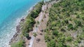 Aerial top view of sea coastline and island with palm trees Royalty Free Stock Photo