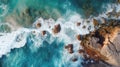 Aerial top view of sea, ocean blue waves crashing on rocky shore Royalty Free Stock Photo