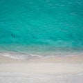 Aerial top view of sea waves crashing against the sandy empty beach Royalty Free Stock Photo