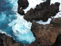 Aerial top view of sea waves hitting rocks on Tenerife, Canary islands Royalty Free Stock Photo