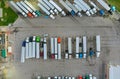 Aerial top view semi truck with cargo trailer car parking of truck dock Royalty Free Stock Photo