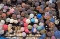 Aerial top view shot of a bunch of people holding umbrellas walking in a market in Ghana Royalty Free Stock Photo