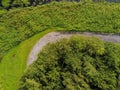 Aerial top view, Small walking path alongside trees in a park Royalty Free Stock Photo