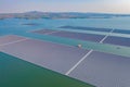 Aerial top view of solar panels or solar cells on buoy floating in lake sea or ocean. Power plant with water, renewable energy