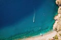 Aerial top view on speed boat row in blue sea Royalty Free Stock Photo