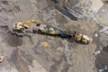 Top view of the stone crusher conveyor belt heavy excavators loading stones into the crusher