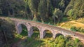 Aerial top view of stone Railway Viaduct in a small village of Pernink, Czech republic. Old Czech railway line. Vintage arch Royalty Free Stock Photo