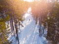 Aerial top view sunset, Cross country skiing in winter on snow covered track in forest stadium Royalty Free Stock Photo