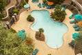 Aerial Top View Of Swimming Pool With Stairs, Empty Chaise Sun Bed Lounge, Umbrella, Palms Royalty Free Stock Photo