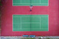 Aerial top view of the tennis court. Single and doubles player lines and areas. Empty field for athletes.