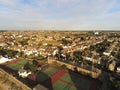 Aerial top view  at tennis courts and private houses in Whitstable, Kent, Uk, England. Evening sunset light on the properties in W Royalty Free Stock Photo