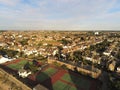 Aerial top view at tennis courts and private houses in Whitstable, Kent, Uk, England. Evening sunset light on the properties in W