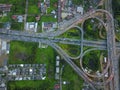 Aerial top view of Toll expressway, Motorway shaped like a triangle or heart, Modern transportation, Multilevel junction highway, Royalty Free Stock Photo