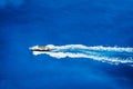 Aerial top view of tourist speed boat sailing in the deep blue sea Royalty Free Stock Photo