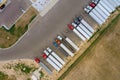 Aerial top view car parking truck stop at the rest area on the highway trucks stand in a row Royalty Free Stock Photo