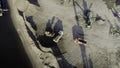 Aerial top view of trucks and machinery in the sand quarry. Scene. Sand pit, loading wagon sand, concept of heavy Royalty Free Stock Photo