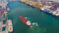 Aerial top view Tugboat drag Oil red ship tanker to dock Royalty Free Stock Photo