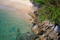 Aerial top view of turquoise sea surface with stones and rocks in water Royalty Free Stock Photo