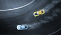 Aerial top view two cars drifting battle on race track
