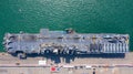 Aerial top view USA aircraft carrier warship transportation fighter plane, helicopter, tank, battleship Royalty Free Stock Photo