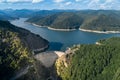 Aerial top view on Vidraru dam, reservoir lake and Fararas mountains, Romania Royalty Free Stock Photo