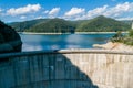 Aerial top view on Vidraru dam, reservoir lake and Fararas mountains, Romania Royalty Free Stock Photo