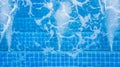 Aerial top view water ripples on blue tiled swimming pool background with jet spa, View from above swimming pool. Royalty Free Stock Photo