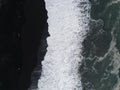 Aerial top view of wave of Black Sand Beach Reynisfjara in Iceland