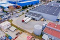 Aerial Top View of White Semi Truck with Cargo Trailer Parking with Other Vehicles on Special Parking Lot