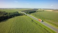 Aerial Top View of White Truck with Cargo Semi Trailer Moving on Road in Direction Royalty Free Stock Photo